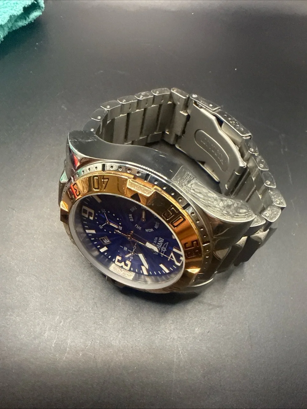 Invicta Silver and Blue Chronograph Watch with Gold Bezel